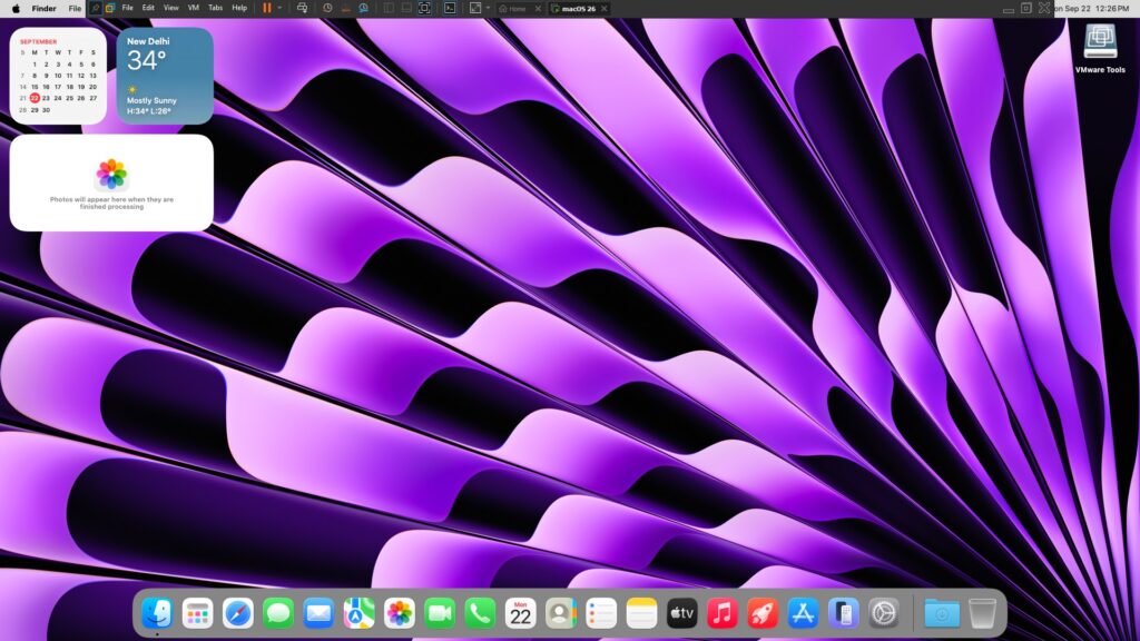 The macOS Tahoe desktop screen, displayed within the VMware virtualization application.
